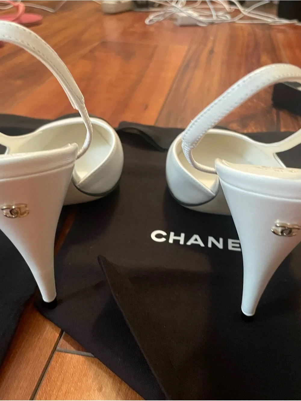 CHANEL White Leather Slingback Heels with Black Cap Toe